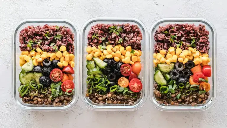 Budget-friendly meal prep with rice, vegetables, and lentils in glass containers